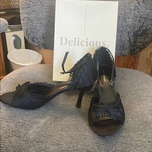 Delicious Elegant Black Heels with Ribbon Accent never worn